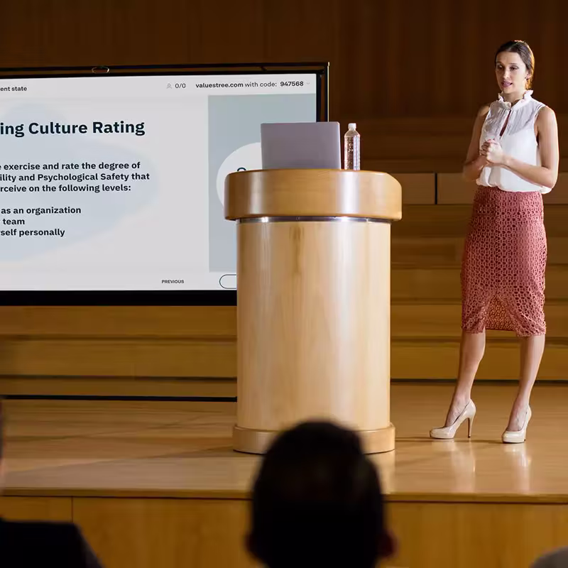 A leader presenting to her team